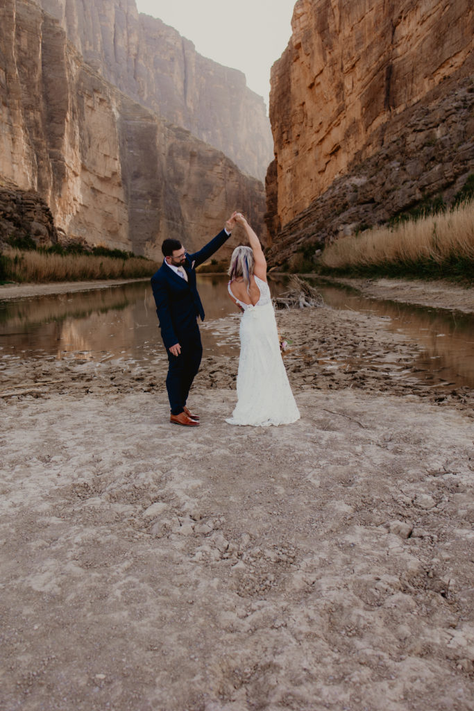 Groom twirling bride in Santa Elena Canyon, Big Bend