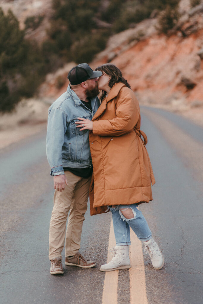 Couple kissing on road in Palo Duro
